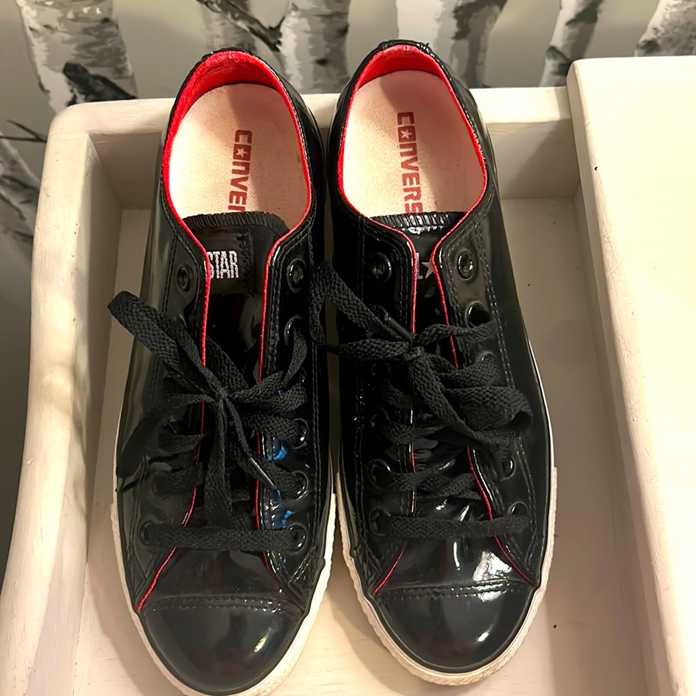 Black shiny patent converse All-Stars size women’s size 9.